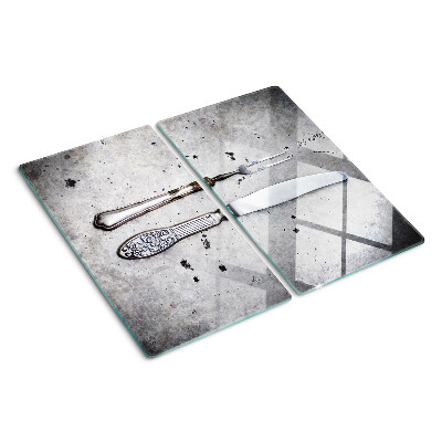Planche à découper en verre Couverts sur fond de béton