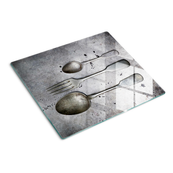 Planche à découper verre Couverts sur fond de béton