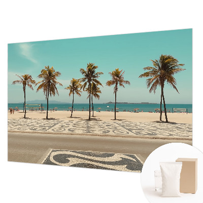 Papier peint panoramique tendance avec une plage bordée de palmiers