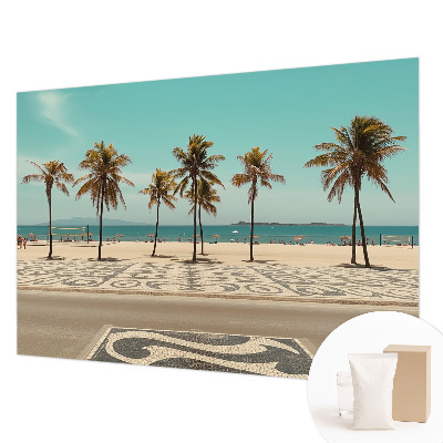 Papier peint panoramique tendance avec une plage bordée de palmiers