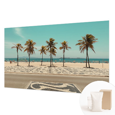 Papier peint panoramique tendance avec une plage bordée de palmiers