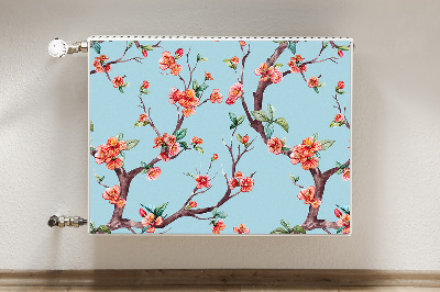 Un tapis avec un imprimé radiateur Un arbre en fleurs