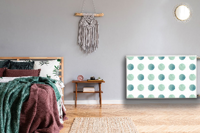 Un tapis avec un imprimé radiateur Points verts