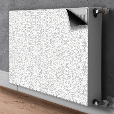 Un tapis avec un imprimé radiateur Ornement floral