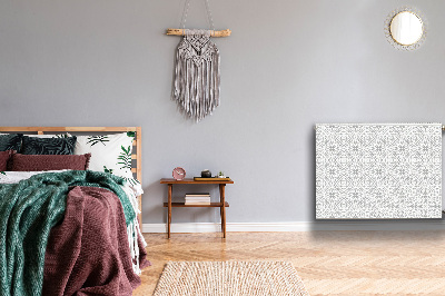 Un tapis avec un imprimé radiateur Ornement floral