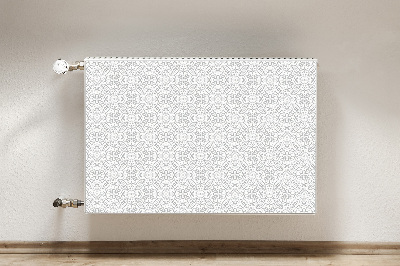 Un tapis avec un imprimé radiateur Ornement floral