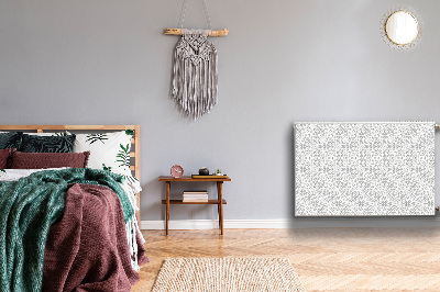 Un tapis avec un imprimé radiateur Ornement floral