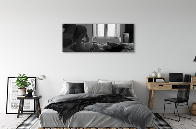 Tableaux sur toile canvas Femme couchée sur la fenêtre de visualisation