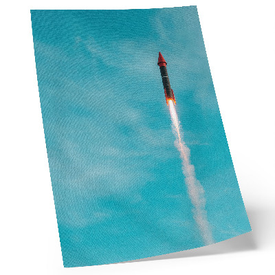 Impression sur toile Une fusée s'élevant dans le ciel bleu