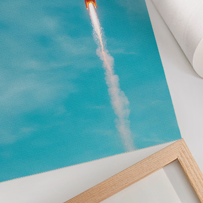 Impression sur toile Une fusée s'élevant dans le ciel bleu