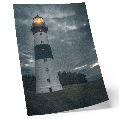 Affiche décorative Un phare se détachant sur un ciel nuageux