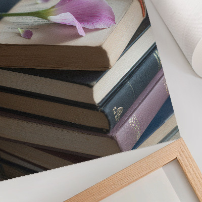 Affiche décorative Une pile de livres surmontée d'une délicate fleur