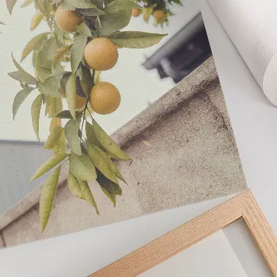 Impression sur toile représentant une branche d'arbre avec un soleil et des feuilles vertes et orange