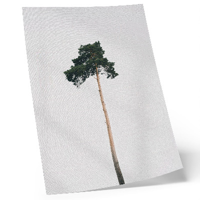 Impression sur toile Un arbre solitaire sur un fond clair, dans un esprit minimaliste.