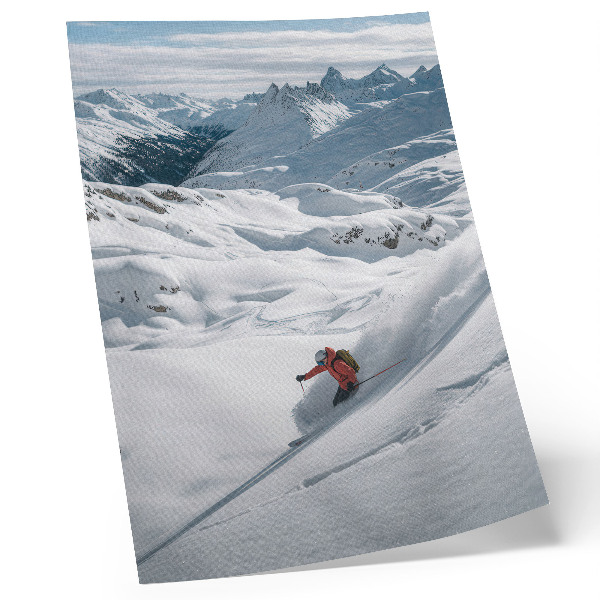Impression sur toile Skieur en action, montagnes blanches, ciel bleu