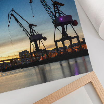 Décoration murale Des grues se détachant sur un coucher de soleil dynamique.