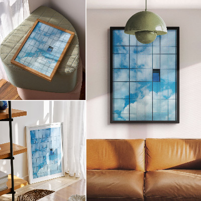 Impression sur toile Une façade de verre reflétant le ciel et les nuages