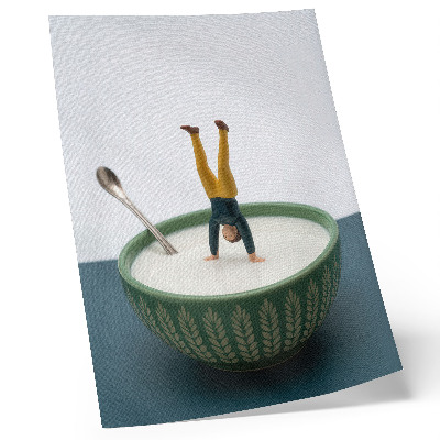 Impression sur toile Figurine dans un bol de lait avec des feuilles vertes