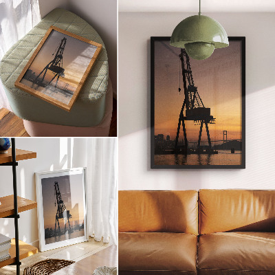 Impression sur toile Silhouette de grue industrielle au coucher du soleil sur le pont
