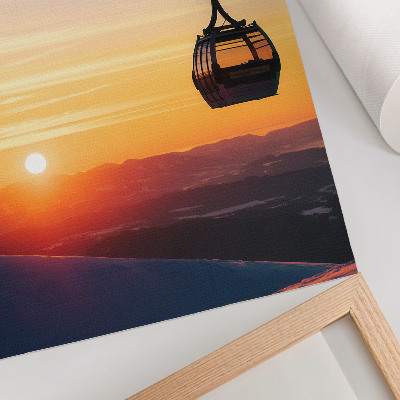 Impression sur toile Téléphérique au coucher du soleil dans les montagnes