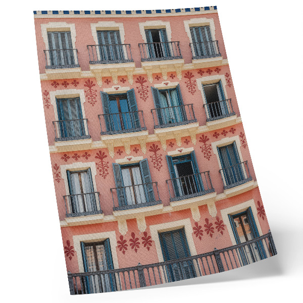 Impression sur toile Façade symétrique avec volets bleu marine et décorations florales