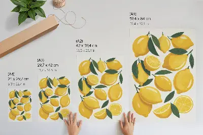 Décoration murale citrons dorés et feuilles vertes sur fond lumineux
