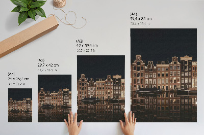 Impression sur toile La ville nocturne se reflète dans l'eau