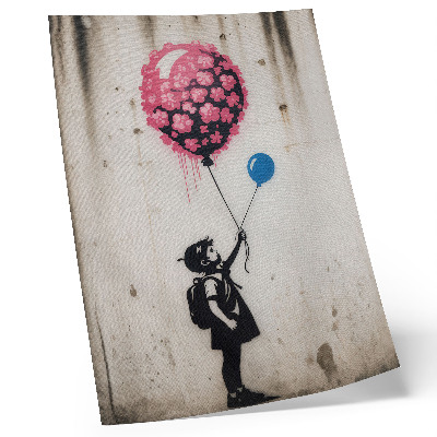 Impression sur toile Enfant avec des ballons sur un fond rugueux