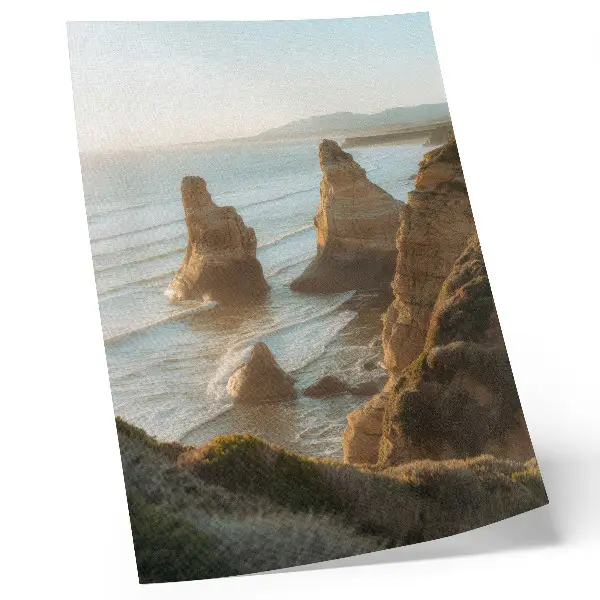 Décoration murale représentant des falaises rocheuses au coucher de soleil sur la mer
