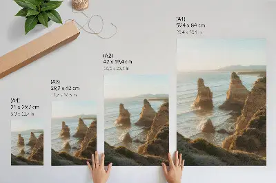 Décoration murale représentant des falaises rocheuses au coucher de soleil sur la mer