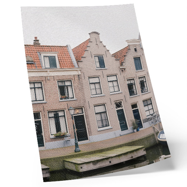 Impression sur toile Immeubles en briques avec toits de tuiles rouges