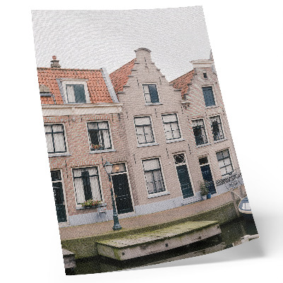 Impression sur toile Immeubles en briques avec toits de tuiles rouges