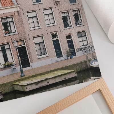 Impression sur toile Immeubles en briques avec toits de tuiles rouges