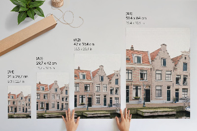 Impression sur toile Immeubles en briques avec toits de tuiles rouges