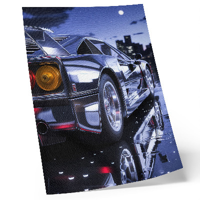 Impression sur toile Les phares nocturnes des voitures de sport brillent en ville.