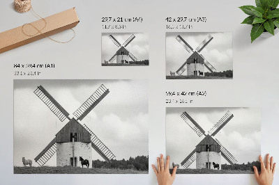 Affiche Un moulin à vent noir et blanc dans un champ avec des chevaux