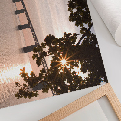 Affiche et poster Un pont pittoresque au coucher du soleil au-dessus de l'eau