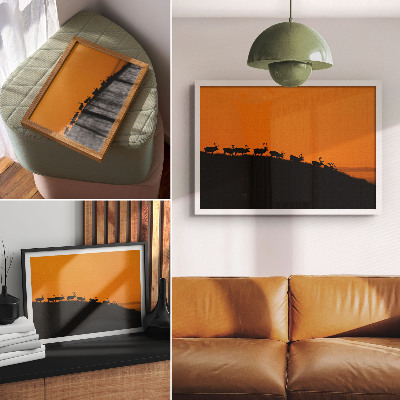 Affiche et poster Silhouettes de cerfs sur une colline avec un fond orange