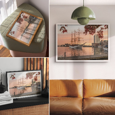 Affiche Un voilier au coucher du soleil, un panorama paisible de la ville