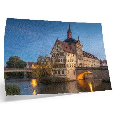 Affiche représentant un bâtiment historique, un pont, de l'eau et un ciel bleu