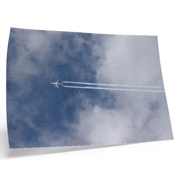 Affiche Avion dans le ciel bleu avec des traînées blanches