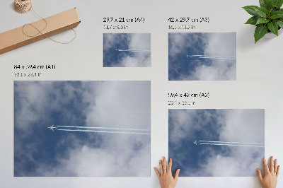 Affiche Avion dans le ciel bleu avec des traînées blanches