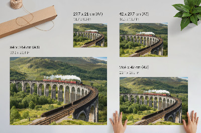 Affiche et poster Un viaduc avec un train au milieu de collines verdoyantes