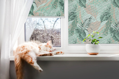 Store fenêtre intérieur avec feuilles tropicales