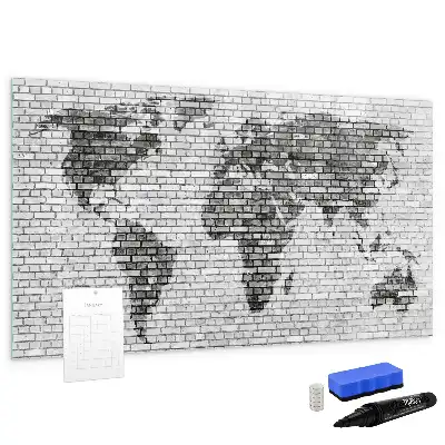 Tableau magnétique représentant une carte du monde sur un mur de briques