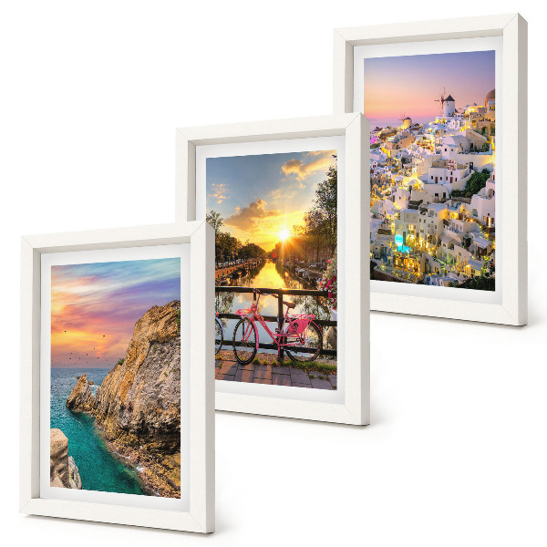 Mur de cadres Vue sur la mer au coucher du soleil et sur la ville