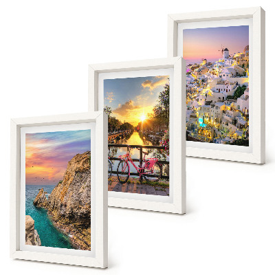 Mur de cadres Vue sur la mer au coucher du soleil et sur la ville