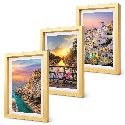 Mur de cadres Vue sur la mer au coucher du soleil et sur la ville