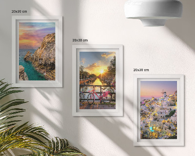 Mur de cadres Vue sur la mer au coucher du soleil et sur la ville