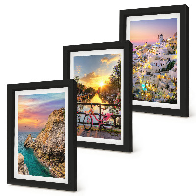Mur de cadres Vue sur la mer au coucher du soleil et sur la ville